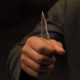 Blade Runner 2036 Screencap--hand holding glass shard